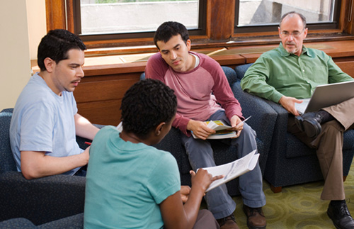 A support group of older teenagers meeting in the Crossroads Support Group setting.