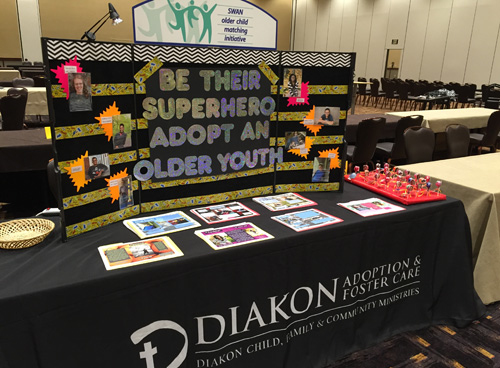 Table top display encouraging PA resource families to consider the adoption of older, special needs youth and children.