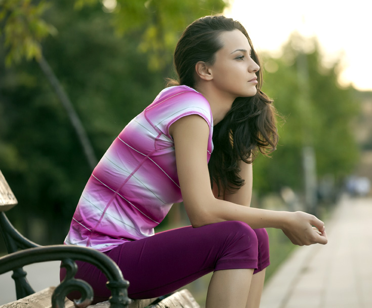 A young mother contemplating her choices following the news of learning she is pregnant.